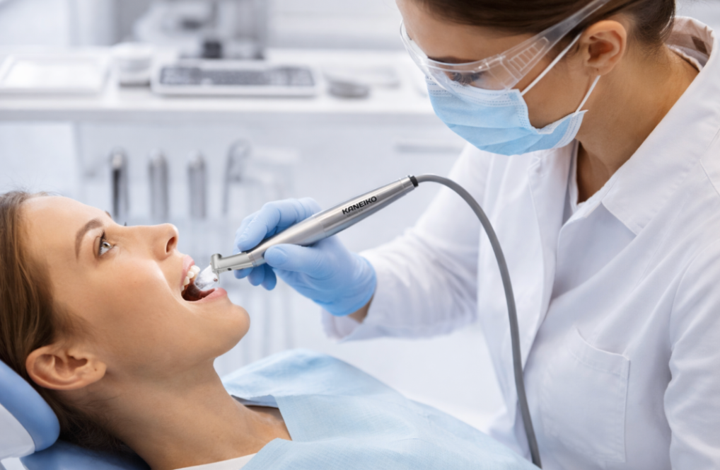 Dental procedure being performed on a patient with a dentist using dental tools.